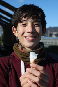 Portrait of smiling boy holding ice cream