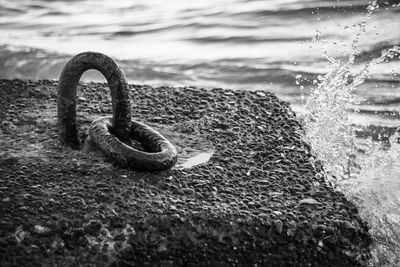 Close-up of rusty metal on beach