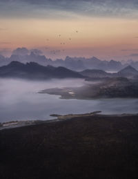 Scenic view of mountains against sky during sunset