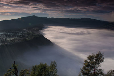 Scenic view of mountains against sky at sunset