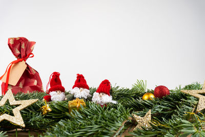 Close-up of christmas decorations over white background