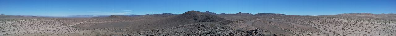 Scenic view of landscape against blue sky