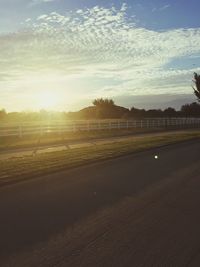 Scenic view of landscape against sky at sunset