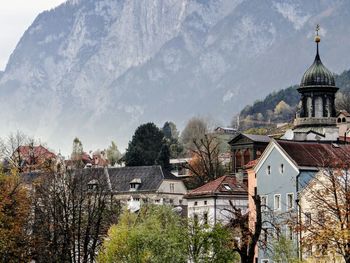 Panoramic view of trees and buildings against sky