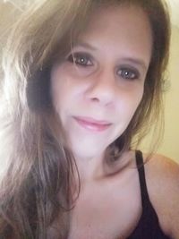 Close-up portrait of a smiling young woman