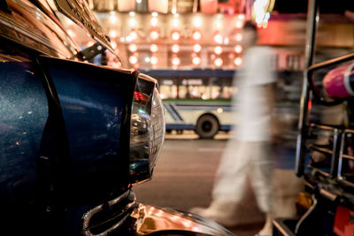 Close-up of car on road at night