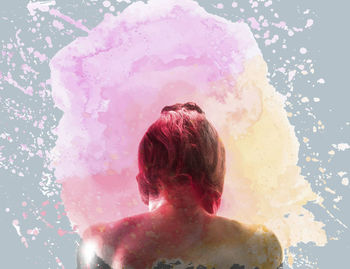 Full length rear view of shirtless man