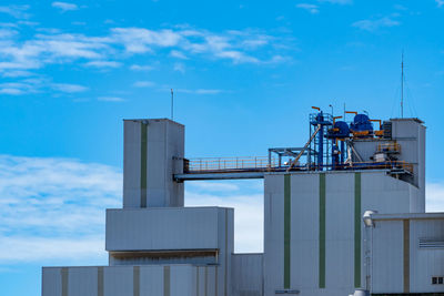 Agricultural silo at feed mill factory. big tank for store grain in feed manufacturing. seed stock