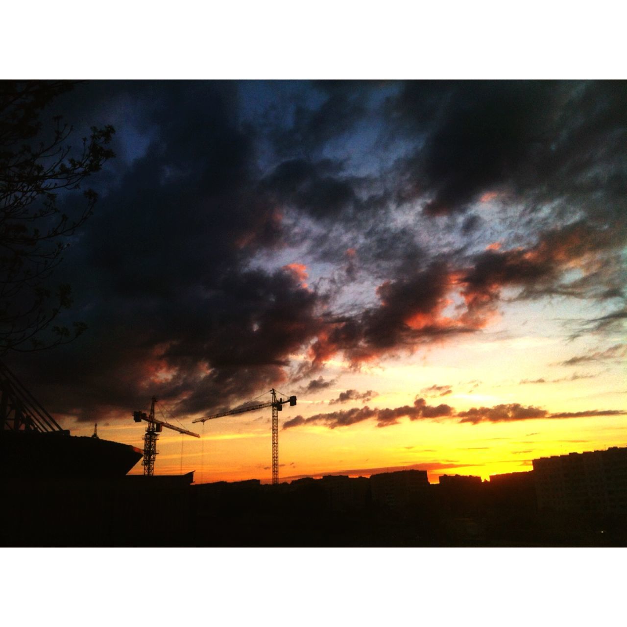 sunset, silhouette, transfer print, sky, cloud - sky, auto post production filter, electricity pylon, cloudy, power line, built structure, building exterior, cloud, dramatic sky, fuel and power generation, architecture, orange color, dusk, low angle view, connection, power supply