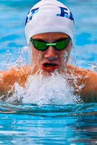 Close-up of teenage boy swimming in pool