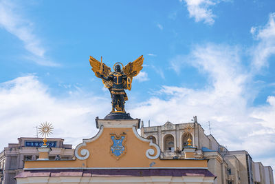 Winged statue of archangel michael, the symbol of the city