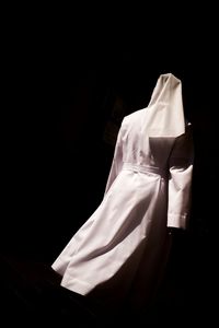 High angle view of white hanging against black background