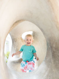 High angle view of woman standing in tunnel