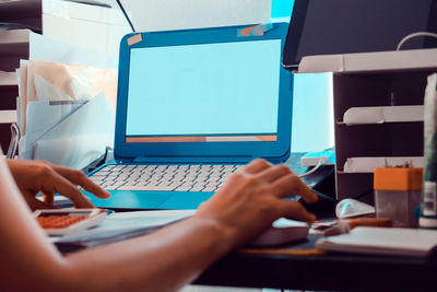 Man using laptop on table