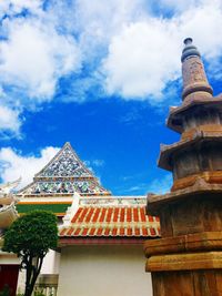 Low angle view of temple against cloudy sky