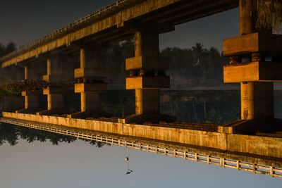 Bridge over river against sky