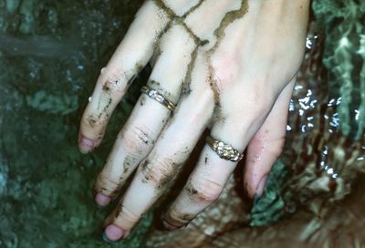 Cropped image of woman dirty hand