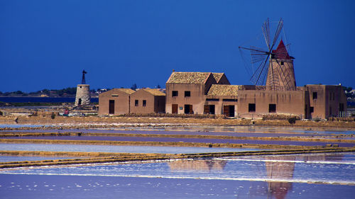 Traditional windmill against blue sky