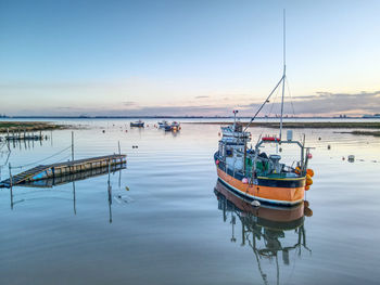 Small fishing boats moored at stone creek inlet, sunk island, east yorkshire, uk