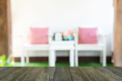 Close-up of empty chairs on table