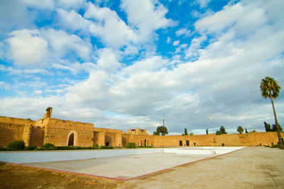 Buildings against cloudy sky