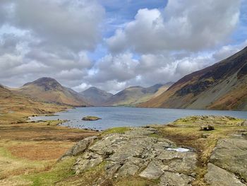 Scenic view of lake and mountains against sky