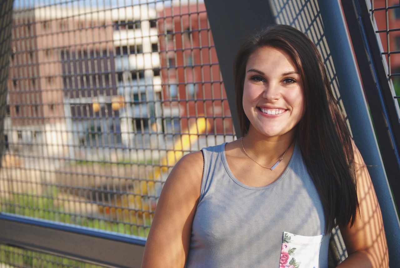 front view, young adult, casual clothing, young women, waist up, leisure activity, focus on foreground, person, looking at camera, medium-length hair, long hair, day