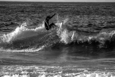 Man surfing on sea