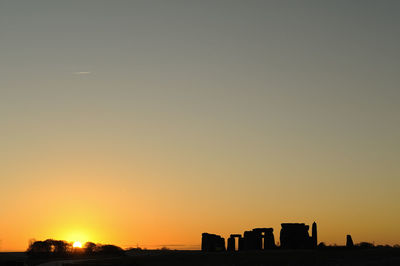 Silhouette of buildings at sunset