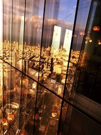 Modern buildings seen through glass window