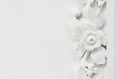 Close-up of sculpture against white wall