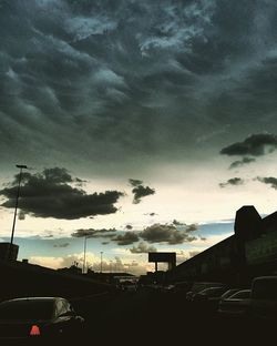 Road against cloudy sky at sunset