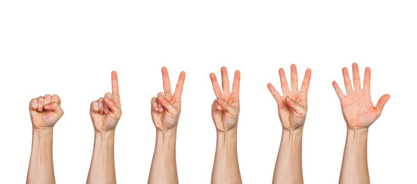 Close-up of hands over white background