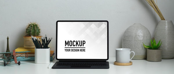 Information sign on table against wall