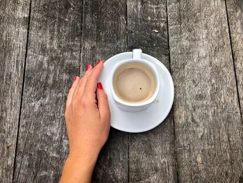 High angle view of coffee cup on table
