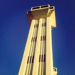 Low angle view of building against clear blue sky