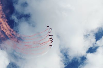 Low angle view of airshow in sky