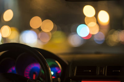 Close-up of illuminated speedometer at night