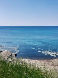 Scenic view of sea against clear sky