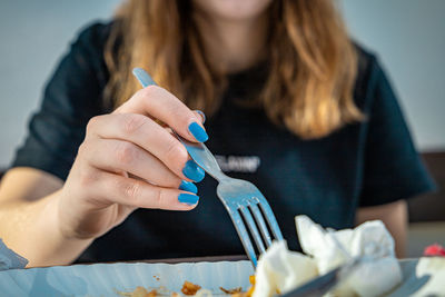 Midsection of woman holding ice cream