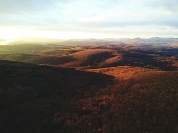 Scenic view of mountains against cloudy sky