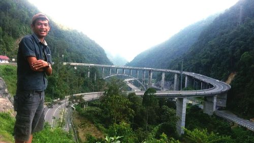 Woman standing on bridge