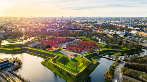 High angle view of river amidst buildings in city