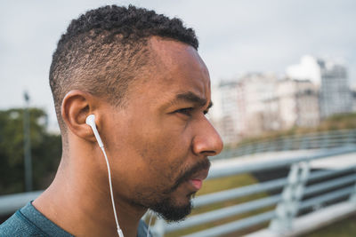 Portrait of young man looking away