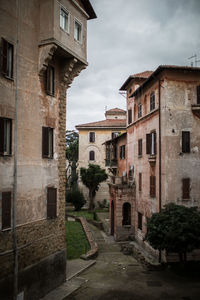 Street amidst buildings against sky