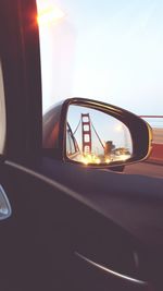 Cars on road at sunset