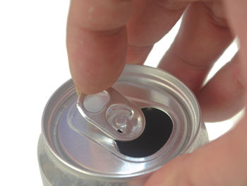 Close-up of hand holding tea cup