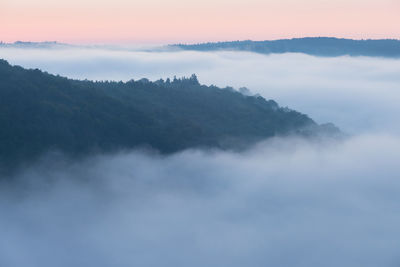 Scenic view of mountains against sky during sunset