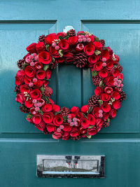 Christmas wreath on a wooden door. christmas decor, front door, charming wreath, christmas mood.