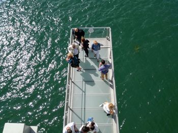 High angle view of people enjoying in sea